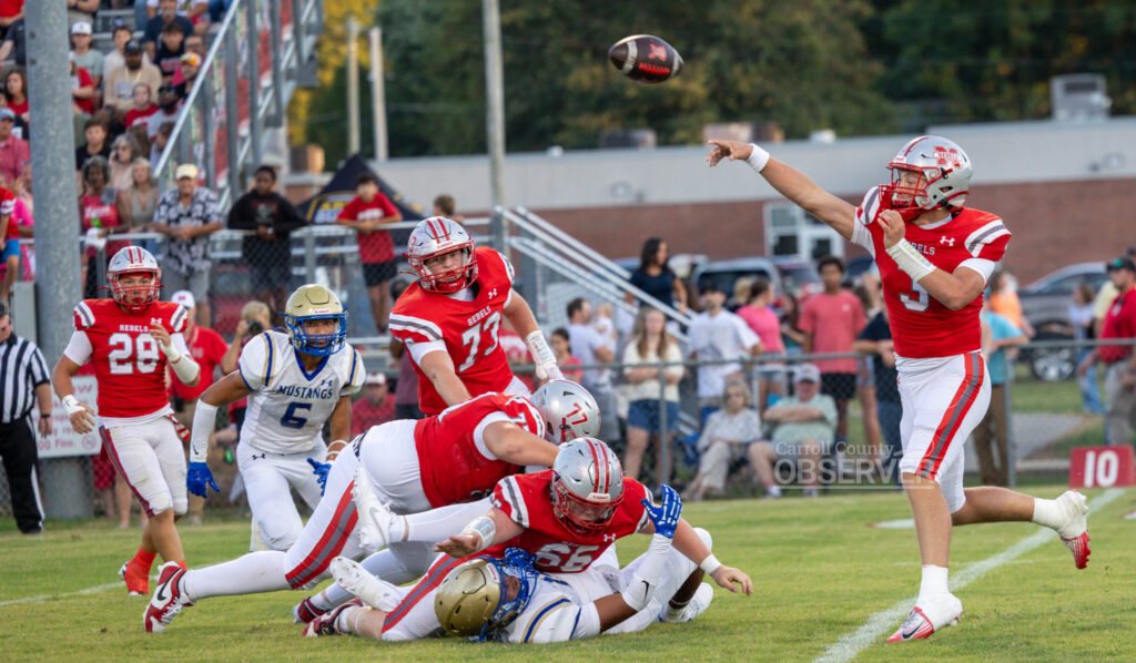McKenzie Rebels quarterback Cole Brown throws a pass during the rivalry game against the Huntingdon Mustangs in Carroll County, Tennessee. Brown passed for 180 yards in the Rebels’ 41-21 loss. Photo by Russell Bush/Huntingdon Sports Pics.