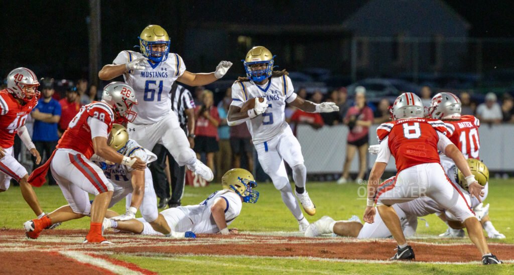 Huntingdon Mustangs running back Tyreke Hutch finds a gaping hole against the McKenzie Rebels in Carroll County, Tennessee. Hutch rushed for 93 yards, scored a touchdown, and added an interception in the 41-21 win. Photo by Russell Bush/Huntingdon Sports Pics.