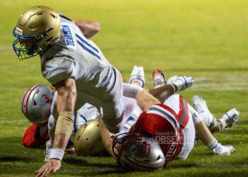 Huntingdon Mustangs quarterback Braylin Dearmon dives across the goal line for a touchdown against the McKenzie Rebels in Carroll County, Tennessee. Dearmon’s dominant night powered Huntingdon’s 41-21 win. Photo by Russell Bush/Huntingdon Sports Pics.