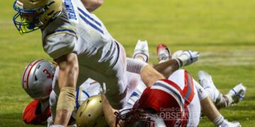 Huntingdon Mustangs quarterback Braylin Dearmon dives across the goal line for a touchdown against the McKenzie Rebels in Carroll County, Tennessee. Dearmon’s dominant night powered Huntingdon’s 41-21 win. Photo by Russell Bush/Huntingdon Sports Pics.