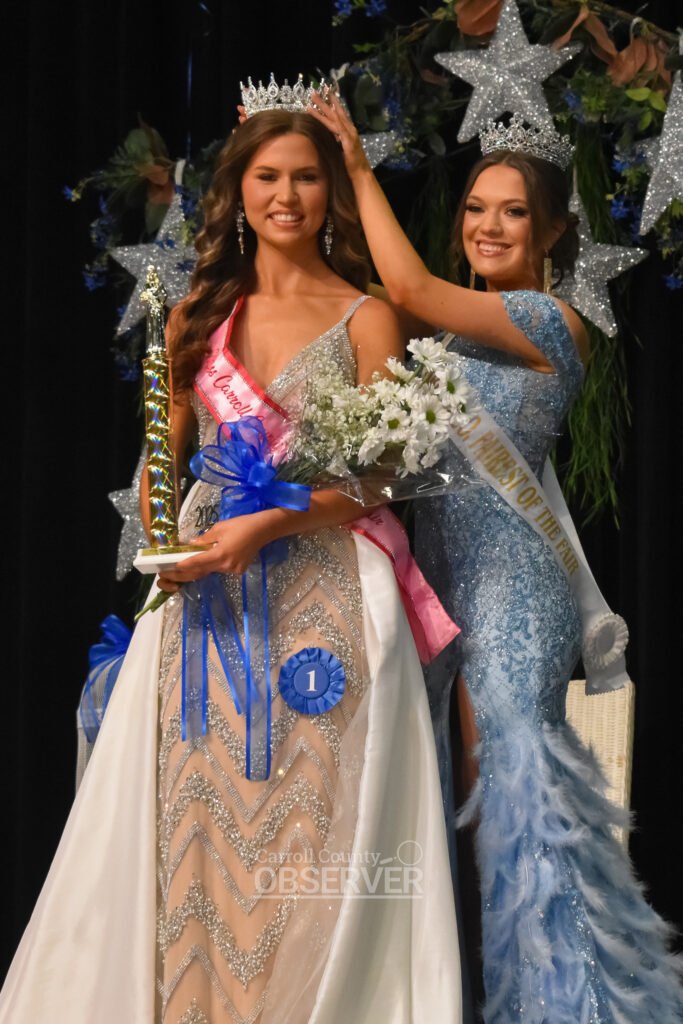 Lily Moore places the crown on Bailey Rogers’ head during the 2025 Carroll County, Tennessee Fairest of the Fair awards ceremony.