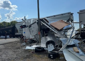 Race car hauler struck by CSX train at SR-105 crossing in Trezevant, Tennessee on August 15, 2025. Debris from the trailer scattered across the railroad crossing as crews worked overnight to clear the wreckage and repair damaged crossing gates. Photo by Jesse Joseph / Carroll County Observer
