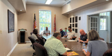 Huntingdon Town Council members seated around the table during their August 26, 2025 meeting in Huntingdon, Tennessee, discussing issues including property tax rates, sewer billing, and beer ordinance changes. Photo by Jesse Joseph/ Carroll County Observer