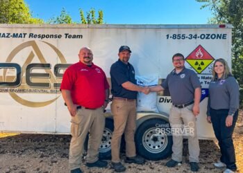 Carroll County Fire Chief Jonathan Gaskins, Ozone Coordinator Andy Kimbrell, EMA Director Trevor Foster, and Administrative Assistant Anna Wheet during the donation of oil dry to Carroll County Hazmat. Photo by Jesse Joseph/Carroll County Observer.