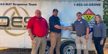 Carroll County Fire Chief Jonathan Gaskins, Ozone Coordinator Andy Kimbrell, EMA Director Trevor Foster, and Administrative Assistant Anna Wheet during the donation of oil dry to Carroll County Hazmat. Photo by Jesse Joseph/Carroll County Observer.