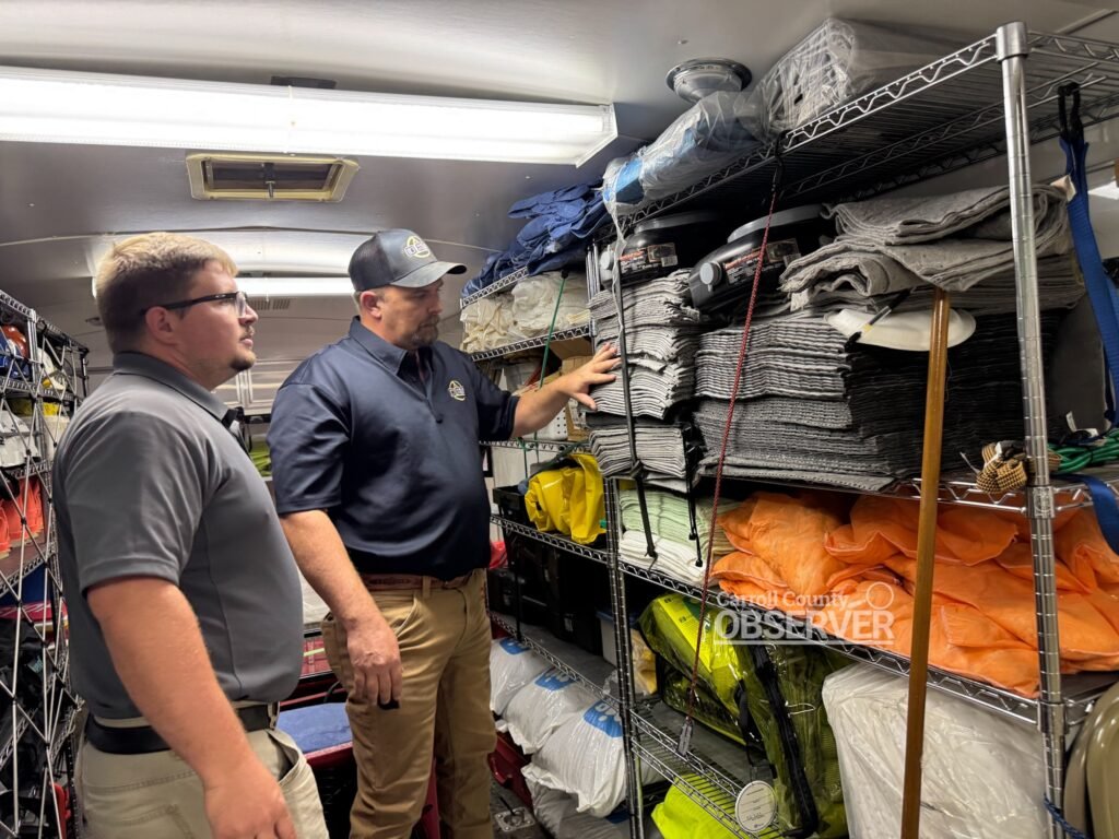 Andy Kimbrell, West Tennessee Coordinator for Ozone Environmental Services, reviews hazmat supplies with Carroll County EMA Director Trevor Foster inside the county’s hazmat trailer. Photo by Jesse Joseph/Carroll County Observer.