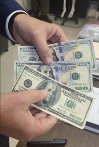 U.S. Secret Service counterfeit $100 bills displayed by Agent Charles Pankenier during CCTC visit. Photo courtesy Carroll County Technical Center / Carroll County Observer.