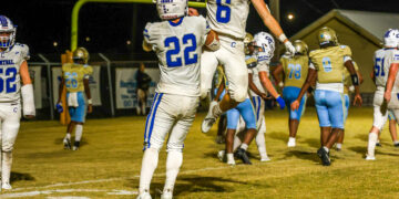Korbin Brown of Hollow Rock-Bruceton Central celebrates a touchdown with Daegan Collins in the Tigers’ win over Fulton County.