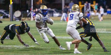 Mustang running back Tyreke Hutch makes a sharp cutback against the Halls defense, part of his 133-yard performance in the 49-6 victory.