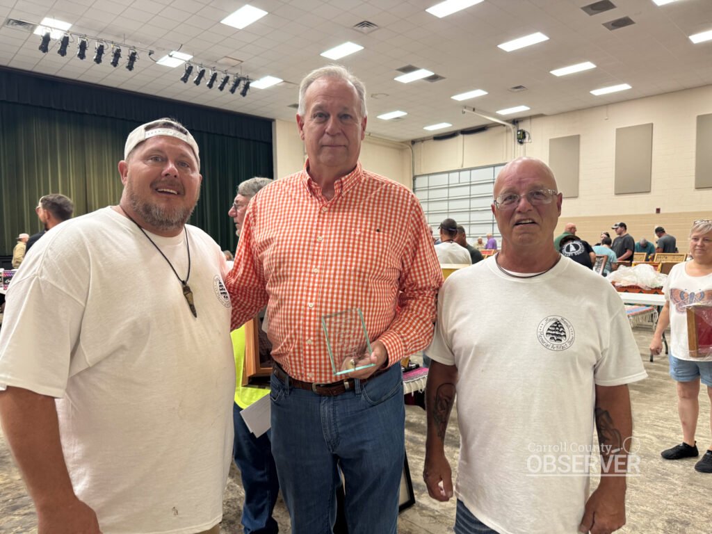 Jeff Wilkes with organizers JB Hampton and Tony Mills at the Jimmy French Memorial Artifact Show. Photo by Jesse Joseph/Carroll County Observer.