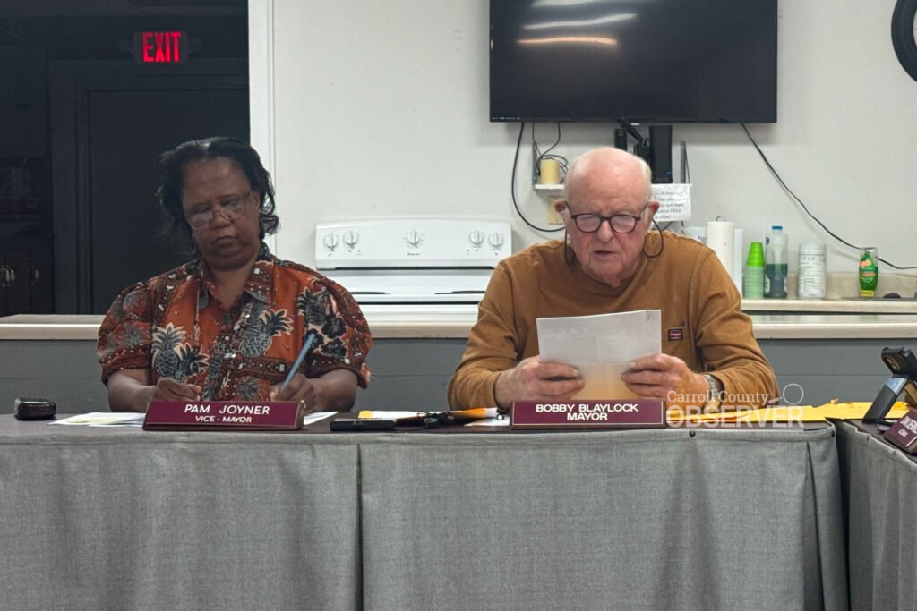 Trezevant Mayor Bobby Blaylock and Vice Mayor Pam Joyner sit at the board table during the September 8, 2025 meeting, where the town approved a bid for water tower cleaning and debated brush pickup.