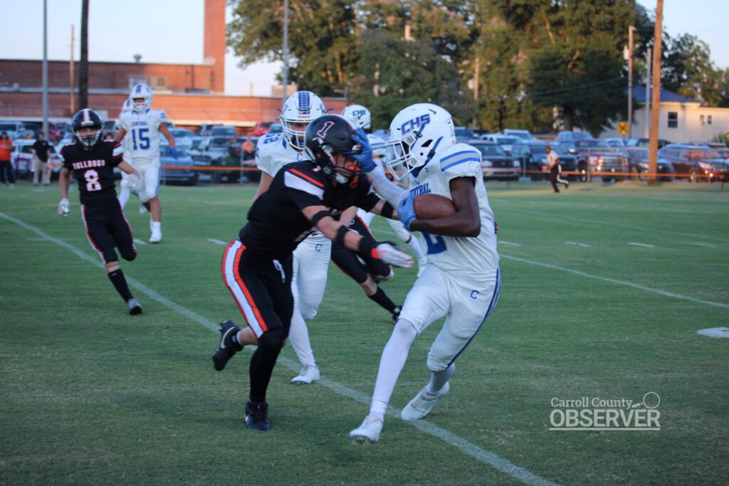 Hollow Rock-Bruceton’s Nic King stiff-arms a Gleason defender while running the ball during the Tigers’ 19-14 win on August 29, 2025. Photo by Jesse Joseph/Carroll County Observer.