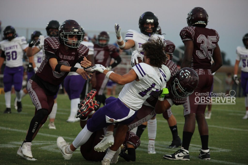 West Carroll War Eagles players tackle a Trinity Christian Academy runner in a high school football game in Atwood, TN, September 12, 2025.