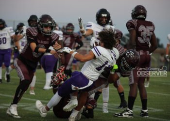 West Carroll War Eagles players tackle a Trinity Christian Academy runner in a high school football game in Atwood, TN, September 12, 2025.