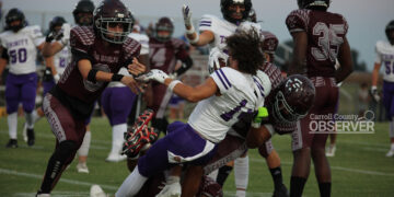 West Carroll War Eagles players tackle a Trinity Christian Academy runner in a high school football game in Atwood, TN, September 12, 2025.