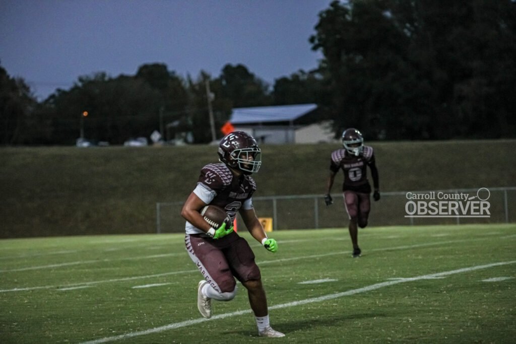West Carroll War Eagles’ Qumarion Patterson carries the football on a kick return during a high school football game against Trinity Christian Academy in Atwood, TN.