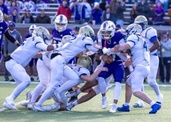 Huntingdon Mustangs tackle a Marion County runner during the 2025 TSSAA BlueCross Bowl in Chattanooga, Tennessee.