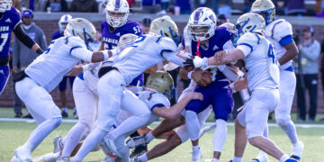 Huntingdon Mustangs tackle a Marion County runner during the 2025 TSSAA BlueCross Bowl in Chattanooga, Tennessee.