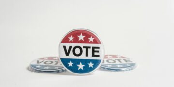 Close-up of a vote button symbolizing election participation and democracy.