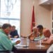 Huntingdon Town Council members seated around a table reviewing documents during a meeting at Huntingdon City Hall.