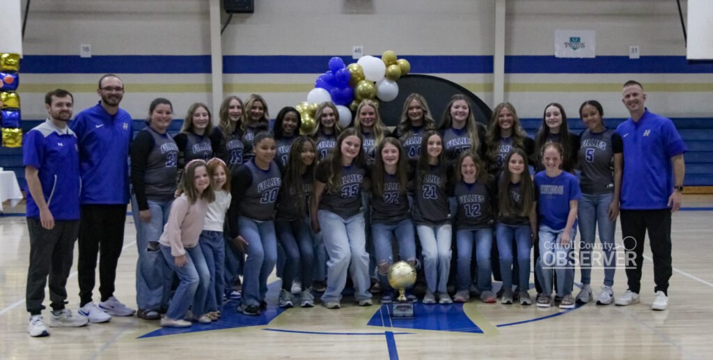 Huntingdon Middle School Fillies basketball team group photo with state championship trophy at Bill Ezell-David Hale Gymnasium.