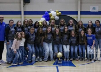 Huntingdon Middle School Fillies basketball team group photo with state championship trophy at Bill Ezell-David Hale Gymnasium.