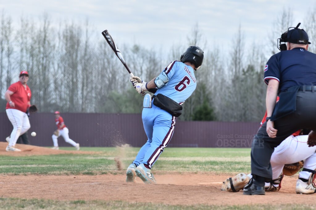 West Carroll's Caleb Vermillion swings during a baseball game against Clarksburg.