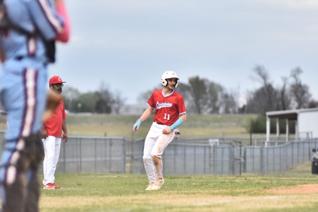 Clarksburg's Reagan Halter stands at third base during a baseball game against West Carroll.