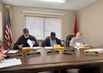 Hollow Rock aldermen sit at the board table during the March 17 meeting.