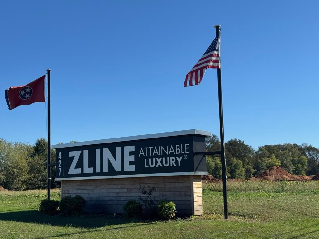 Zline Kitchen sign with Tennessee and American flags at the company's Carroll County location.