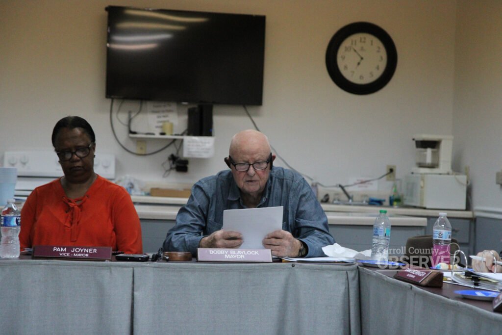Mayor Bobby Blaylock reading fireworks ordinance at Trezevant board meeting with Vice Mayor Pam Joyner seated to his left.