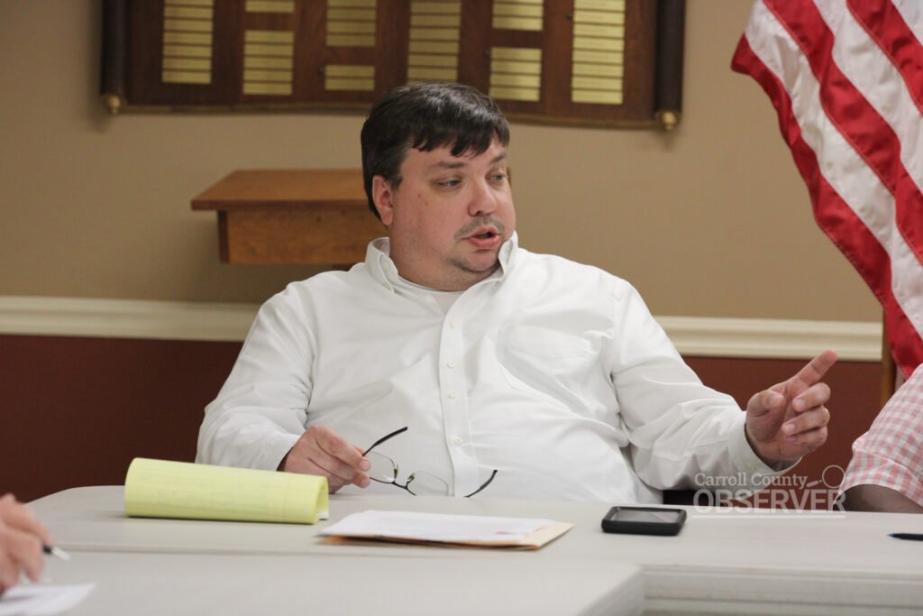 Attorney Beau Pemberton gestures while speaking at a table during a board meeting at Atwood City Hall.