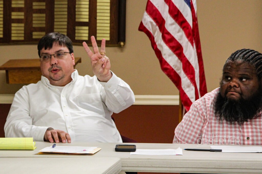 Attorney Beau Pemberton holds up three fingers while addressing the Atwood board of mayor and aldermen during a special-called meeting.