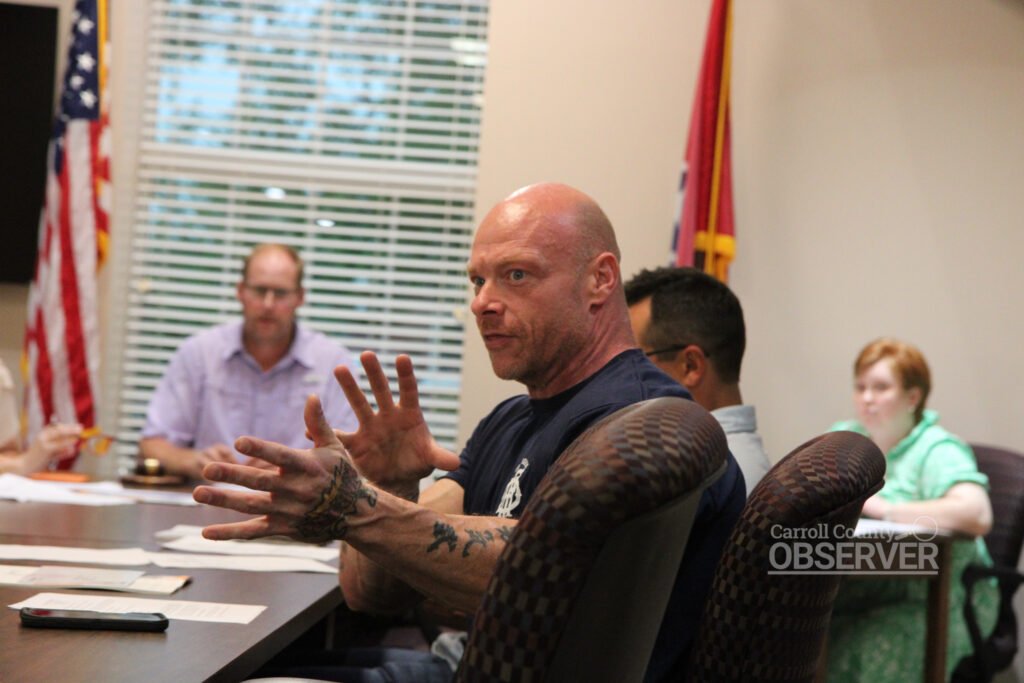 Council member Chad Barnhart gesturing while speaking during Huntingdon Town Council meeting.