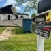 TBI "Burn an Arsonist" flyer on a mailbox with the destroyed home visible in the background.