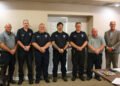 Huntingdon Fire Chief John Fordon, firefighters Tim Walton, Brad Hampton, Brett Hampton, Noah Maxwell, Brian McDowell, and Mayor Chad Edwards pose together after the firefighter swearing-in ceremony.
