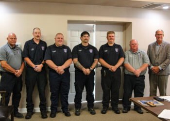 Huntingdon Fire Chief John Fordon, firefighters Tim Walton, Brad Hampton, Brett Hampton, Noah Maxwell, Brian McDowell, and Mayor Chad Edwards pose together after the firefighter swearing-in ceremony.