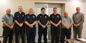 Huntingdon Fire Chief John Fordon, firefighters Tim Walton, Brad Hampton, Brett Hampton, Noah Maxwell, Brian McDowell, and Mayor Chad Edwards pose together after the firefighter swearing-in ceremony.