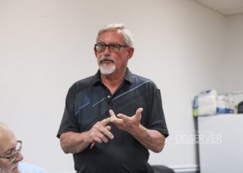 Alderman Don Barger standing and speaking at Trezevant board meeting August 2026 with another board member visible to his left.